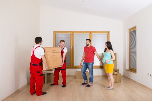Professional removals staff reviewing safety checks before loading a vehicle
