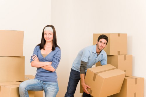 Local removals team planning a move on an Acton street