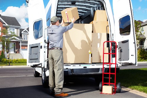 Furniture and household items being loaded for an Acton move