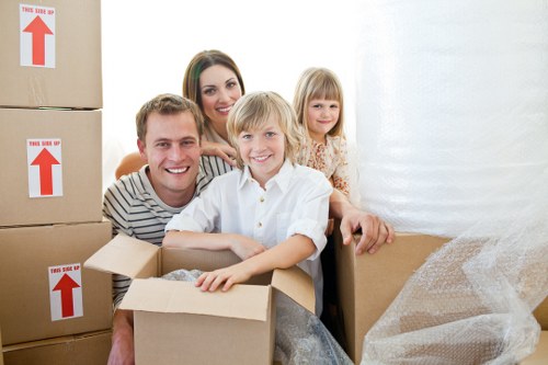 Residential moving scene showing careful packing for Acton removals