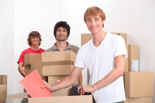 Furniture and boxes being transported by a local removals team