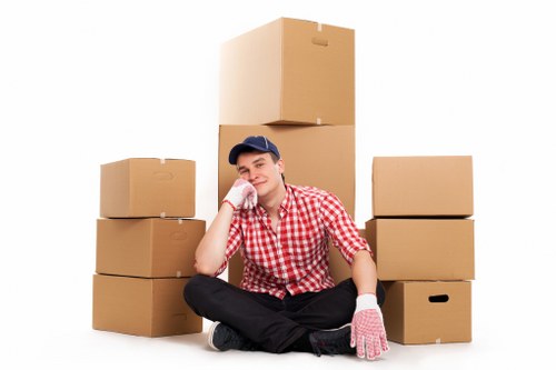 Team handling office furniture and equipment during an Acton move